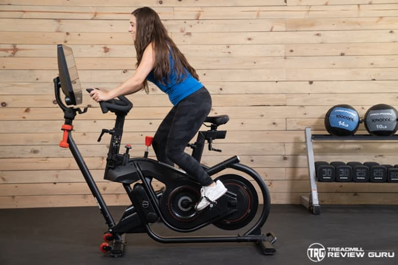 Bowflex Velocore Woman Standing Pedaling