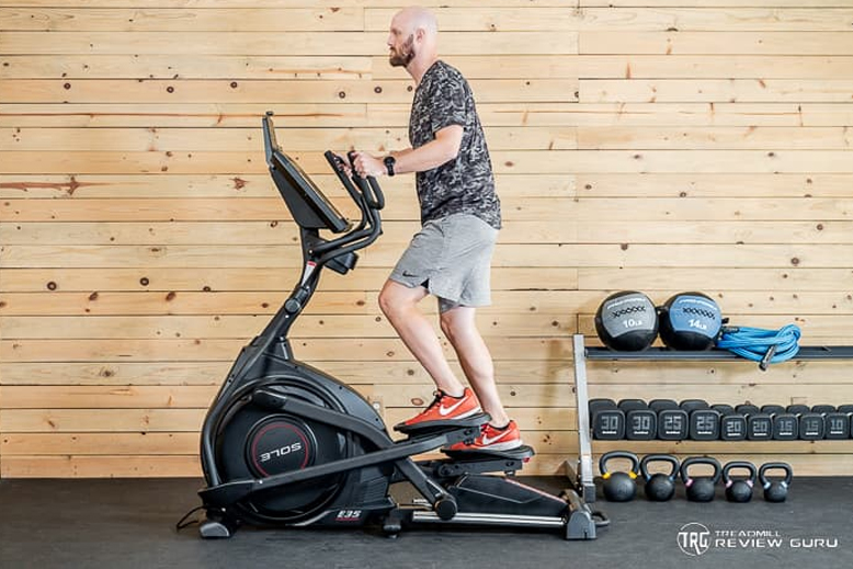 Sole E35 Man Using Elliptical
